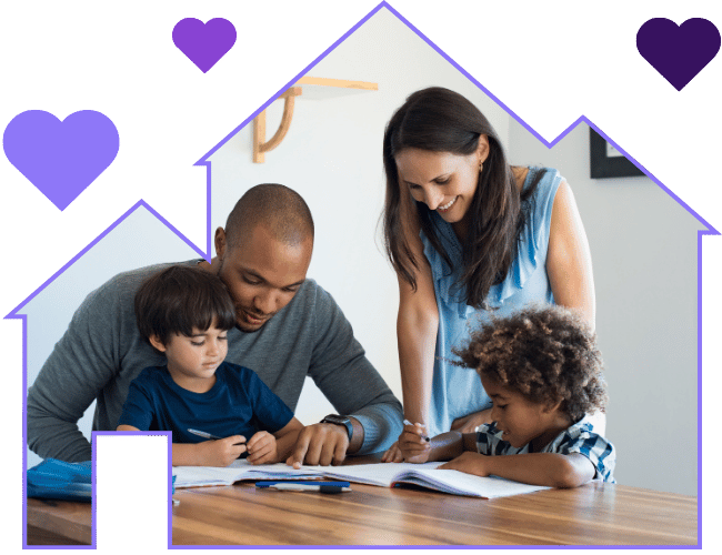 Smiling parents helping their two young children with homework at a table, framed by a house outline with heart shapes.